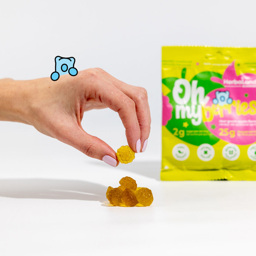 Herbaland Gummies - A close up of gummies with oh my low sugar high fibre candies in sour green apple flavor