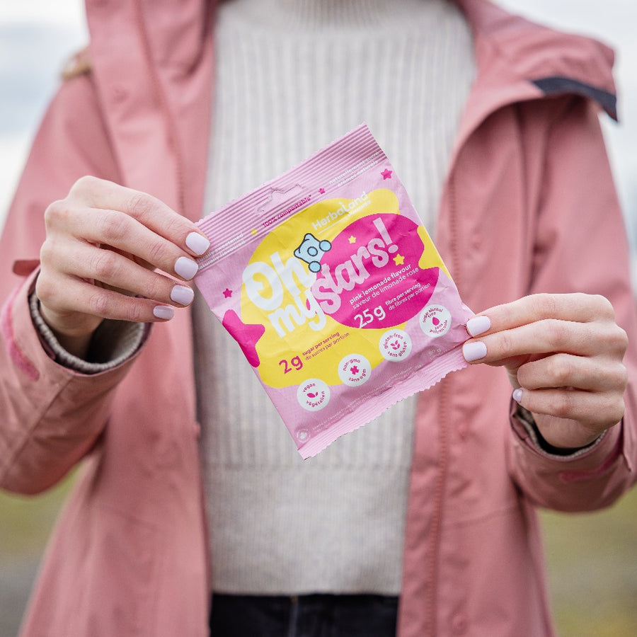 Herbaland Gummies - Lifestyle image of oh my gummies, low sugar, high fibre gummies in pink lemonade flavor