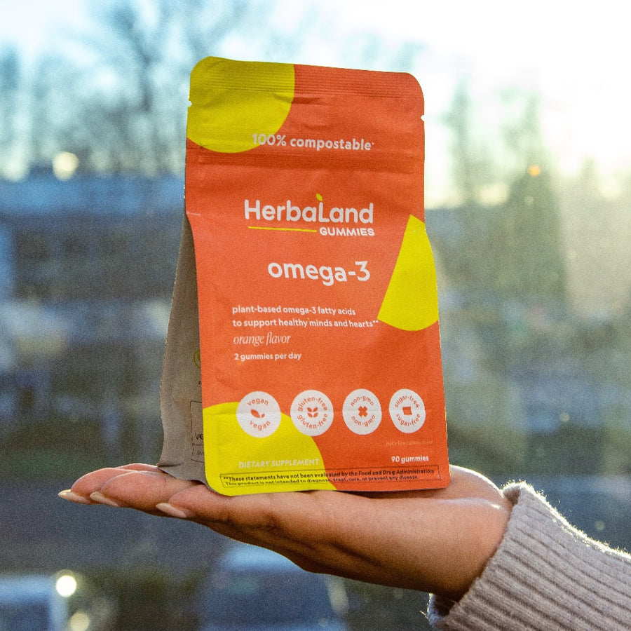 A pouch of herbaland omega-3 gummies for adults to help to get plant based omega-3 fatty acids to support healthy mind for adults with orange flavor